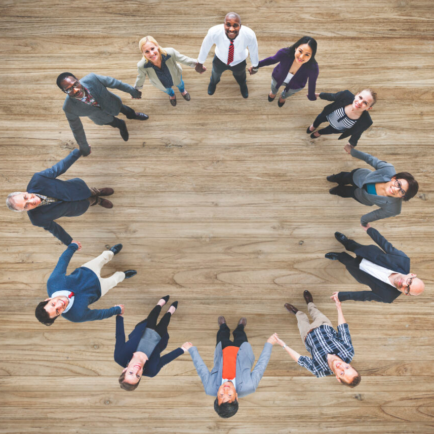 aerial-view-diverse-business-people-holding-hands-togeher-teamwork-1024x857 (1)